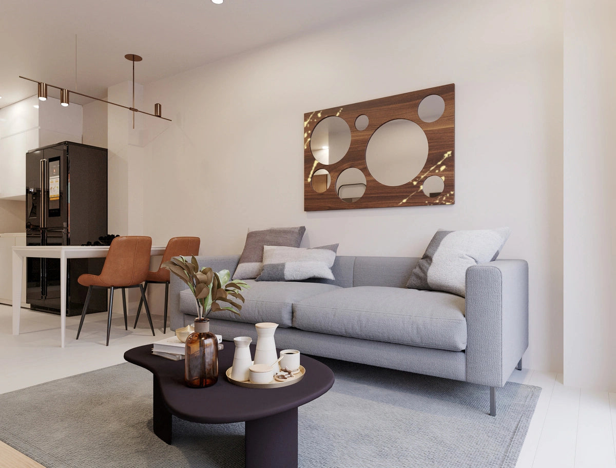 walnut wood wall mirror with golden accents in a casual living room